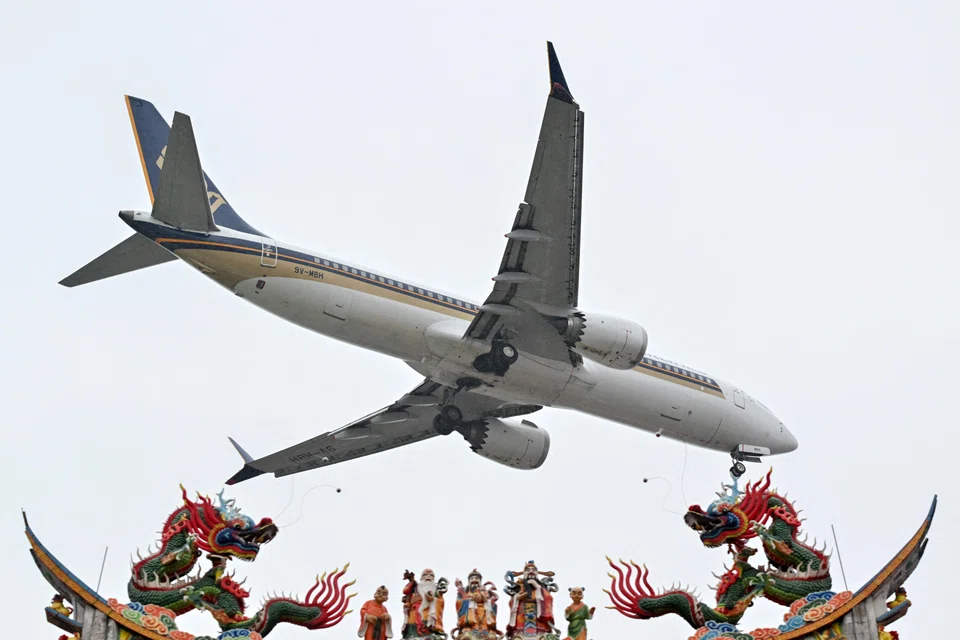 A Singapore Airlines plane flying over Chaotian Palace in Xiamen, Fujian, China. The carrier is the second-highest ranked Asian company behind Toyota, which came in at 25th place.