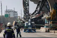 At least two people were killed when a crane collapsed from an under-construction elevated expressway onto a road in Thailand’s Samut Sakhon province.