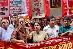 Garment workers and activists taking part in a protest in Dhaka. The unions want a tripling of wages to 23,000 takas.