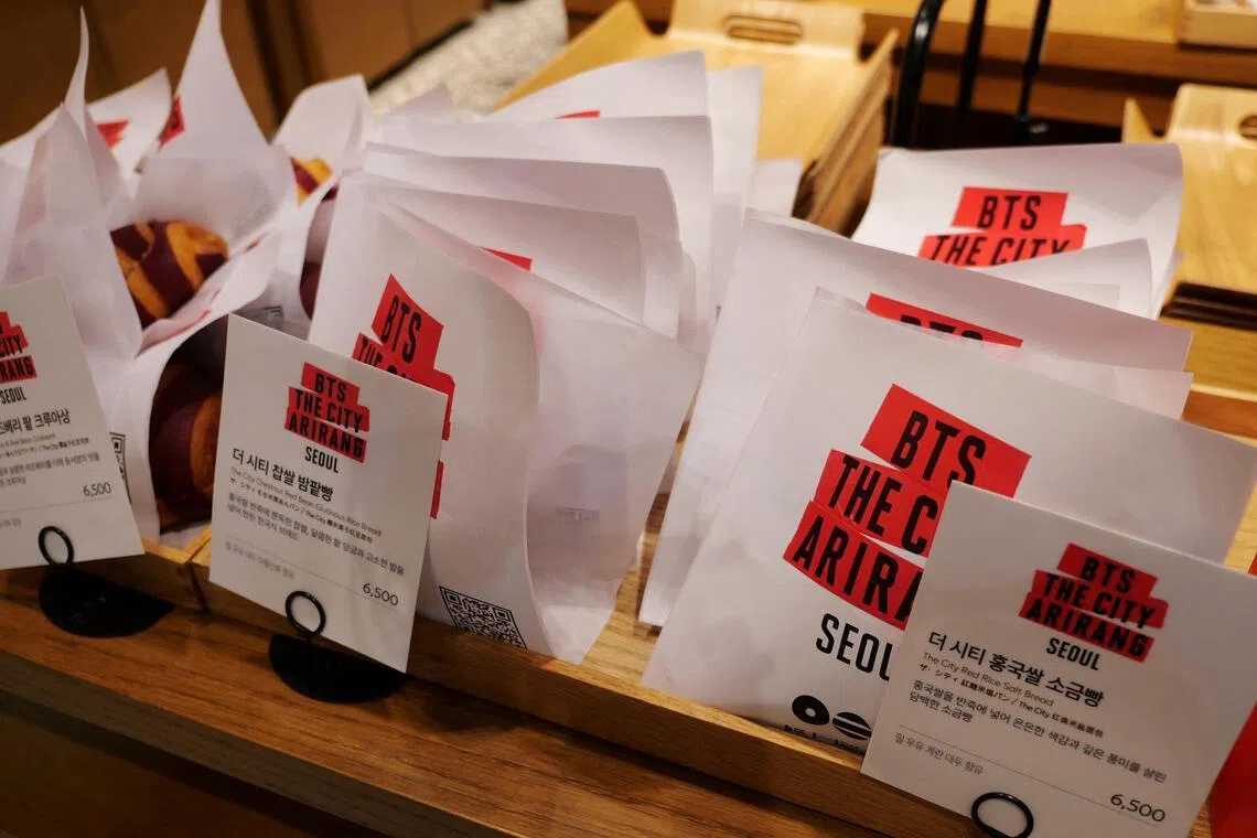 Bakery products bearing BTS logos on display at a cafe in Seoul. South Korea is already reaping the benefits from BTS' reunion. 