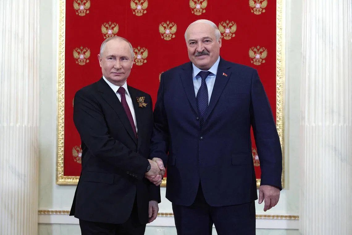 (FILES) Russian President Vladimir Putin and Belarus' President Alexander Lukashenko at the Victory Day military parade in Moscow on May 9, 2023. The weekend mutiny in Russia ended after Lukashenko negotiated a truce with Yevgeny Prigozhin; the Wagner leader stood down his troops and left in exile to Belarus.  
