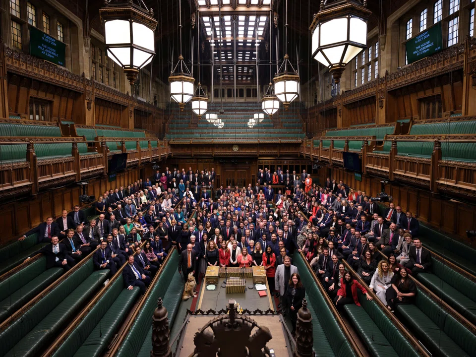 Newly elected British MPs in the House of Commons Chamber on Jul 9. The writer describes the country's electoral system as perfectly Churchillian: the worst of systems except for all the plausible alternatives.