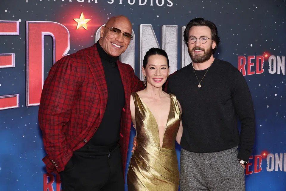(From left) Dwayne Johnson, Lucy Liu and Chris Evans attend the premiere of Amazon and MGM Studios' "Red One" at Alice Tully Hall, Lincoln Centre in New York City, New York, Nov 11, 2024.