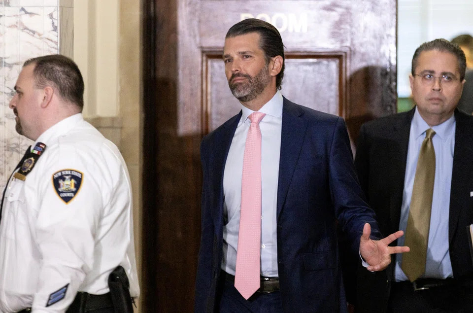 Donald Trump Jr (centre), son of former US President Donald J. Trump, exits the courtroom after attending the afternoon session of the ongoing civil fraud trial being litigated in New York, New York, Nov 1, 2023. 