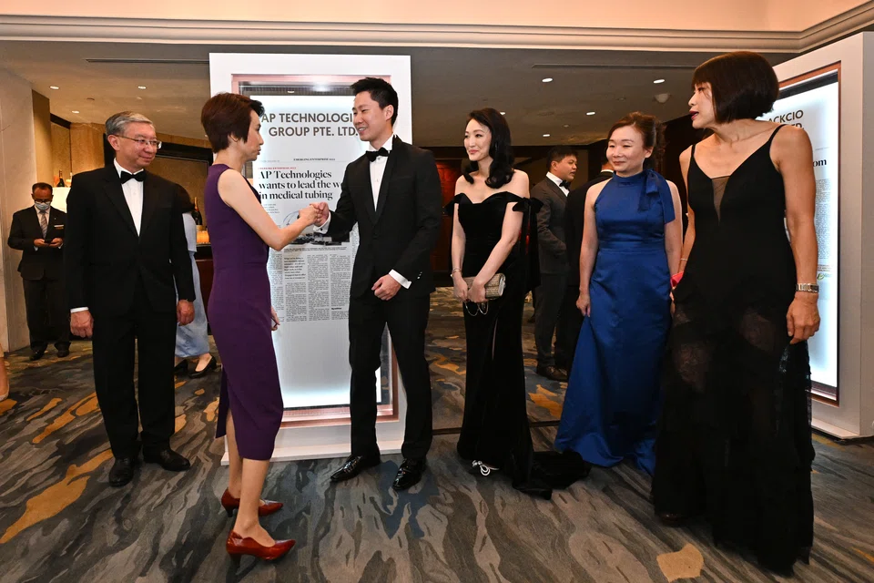 Minister of State for Trade and Industry Low Yen Ling shaking hands with Charles Tang, chief executive of AP Technologies. AP Technologies is one of three top winners of the Emerging Enterprise Awards 2022.