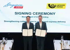CEO of SingPost international Li Yu (left) and CEO of Lithuania Post Rolandas Zukas at the signing ceremony on May 8.