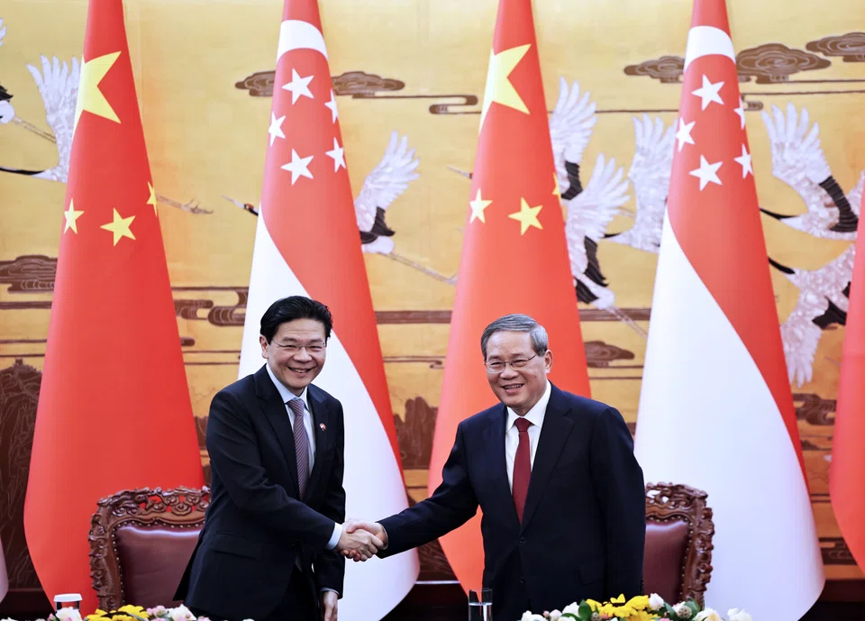 Singapore Prime Minister Lawrence Wong (left) and China Premier Li Qiang during PM Wong's official visit to China in June.