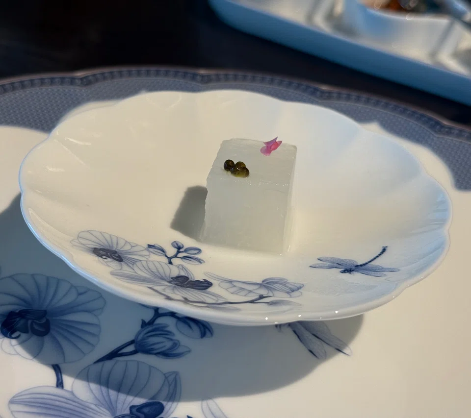Sculpted square of winter melon as a starter.