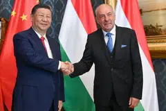 Chinese President Xi Jinping (left) shakes hands with his Hungarian counterpart Tamas Sulyok prior to their official talks in Blue Hall of presidential palace in Budapest, Hungary.
