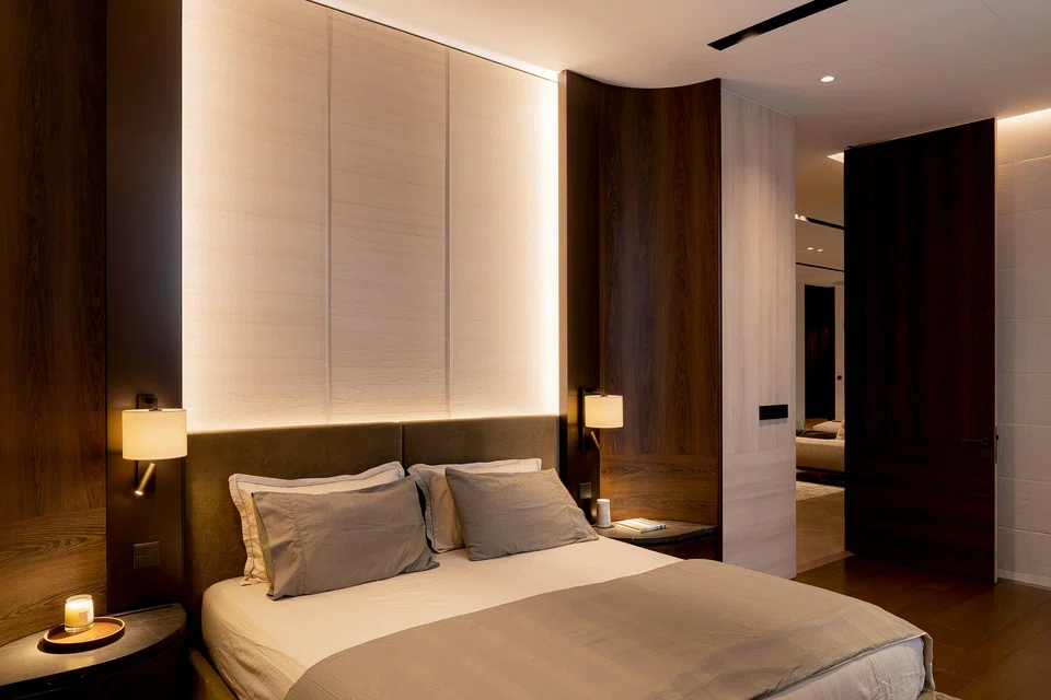 Curved edges around the bed frame in the son’s master bedroom give a cocooning effect.