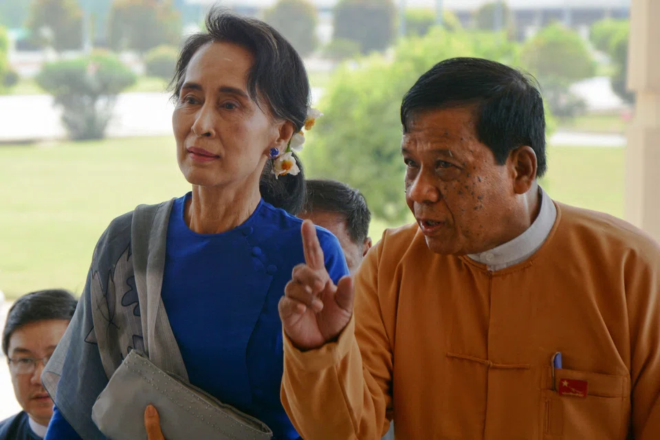 Myanmar's National League for Democracy senior leader and lawmaker Zaw Myint Maung (right) escorts Myanmar democracy leader Aung San Suu Kyi during her arrival at the parliament in Naypyidaw on March 1, 2016. Zaw died of leukaemia on Oct 7, 2024 aged 72.