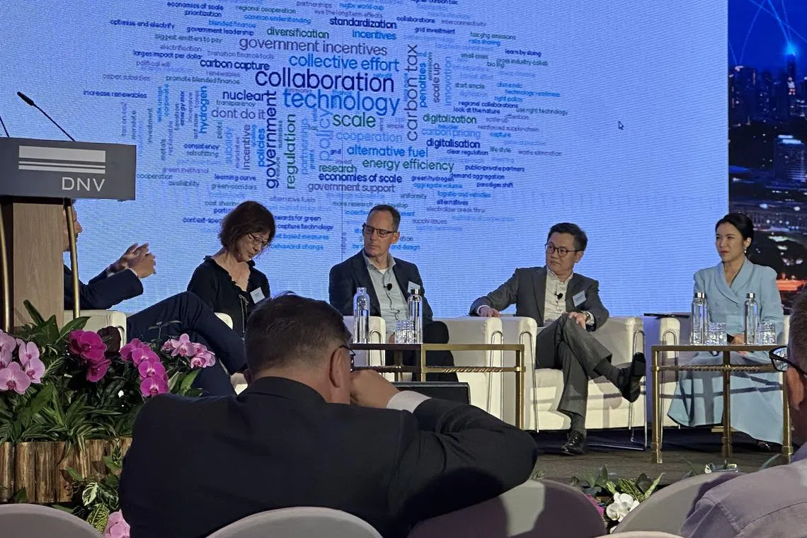From left: DNV's Brice Le Gallo (partially hidden), CPC Taiwan's Jane Liao, Woodside Energy's Shaun Gregory and Keppel Infrastructure's Chua Yong Hwee at the DNV Singapore Energy Transition Conference panel discussion moderated by Yvonne Chan (far right).
