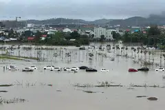 Flood waters submerge parked cars in Hue, Vietnam on Nov 15,2023. Given the higher risk profiles of emerging markets, they also tend to face higher costs of capital from private sector investments. 