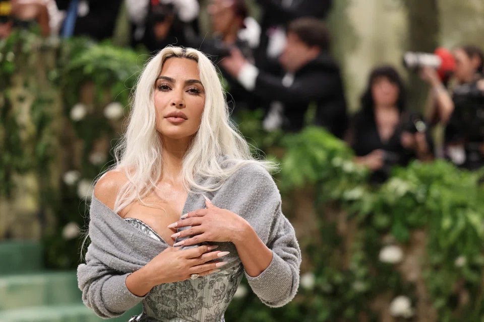 Kim Kardashian poses at the Met Gala, an annual fundraising gala held for the benefit of the Metropolitan Museum of Art's Costume Institute in New York City, US, May 6, 2024. Kardashian has lost hundreds of thousands of Instagram followers in recent days, according to analytics site Social Blade.