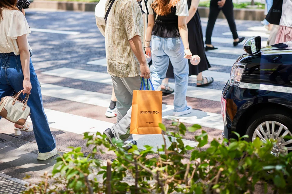 A healthy portion of the purchases by Chinese tourists occurred in Japan, where the well-heeled took advantage of the weak yen to buy Louis Vuitton bags and other costly items for less.