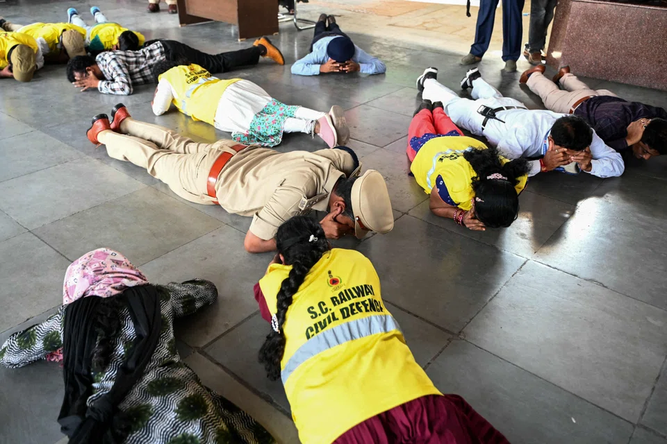 Police and railway civil defence personnel conducting an emergency simulation drill as a part of the nationwide civil defence mock drills at a railway station in Hyderabad, India, on May 7 as border tensions surge. 