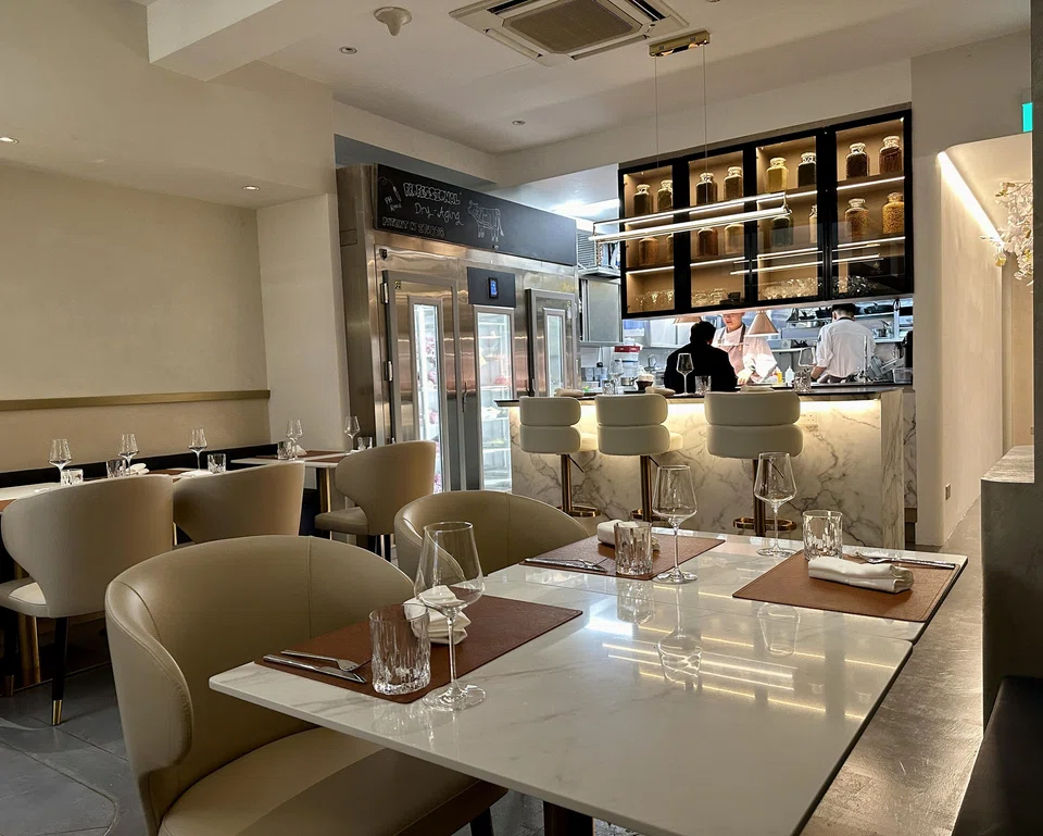 WIld Blaze's pale interiors and dry-ageing fridge tucked into the kitchen area.