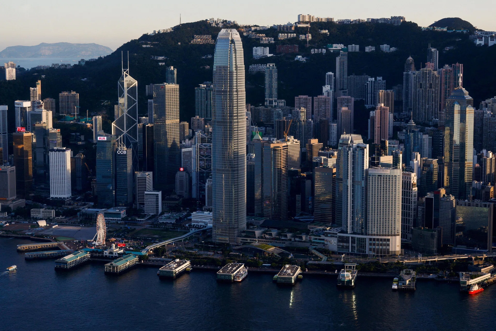 Hong Kong plans tax cuts on bonus pay to lure top fund managers: sources