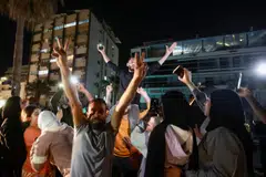 A crowd in Sidon, Lebanon, celebrates on Apr 17 as displaced people return to their homes after a ceasefire between Lebanon and Israel went into effect.