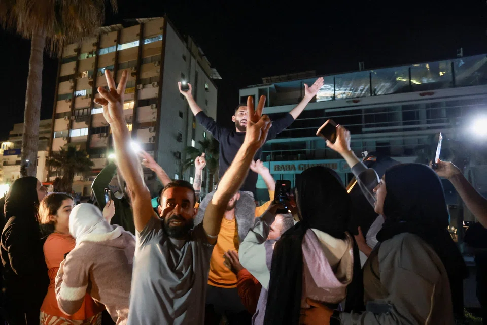 A crowd in Sidon, Lebanon, celebrates on Apr 17 as displaced people return to their homes after a ceasefire between Lebanon and Israel went into effect.