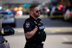 A police officer near the Old National Bank building in downtown Louisville, Kentucky, on Monday (Apr 10). Early reports said there were multiple casualties.