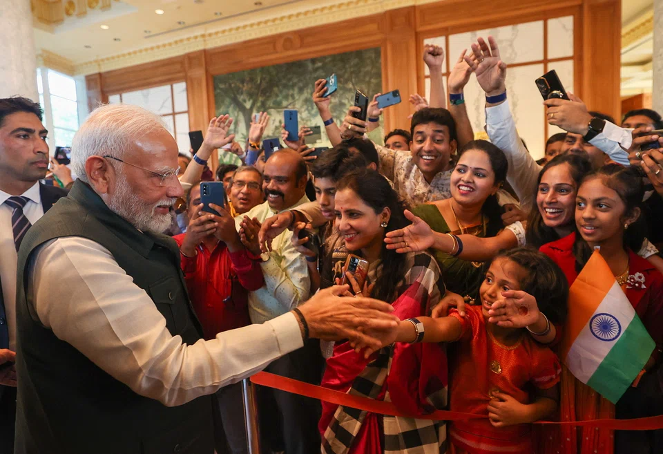 Indian Prime Minister Narendra Modi being welcomed by the Indian community in Brunei upon his arrival there on Tuesday. This is the first time an Indian PM has visited Brunei.