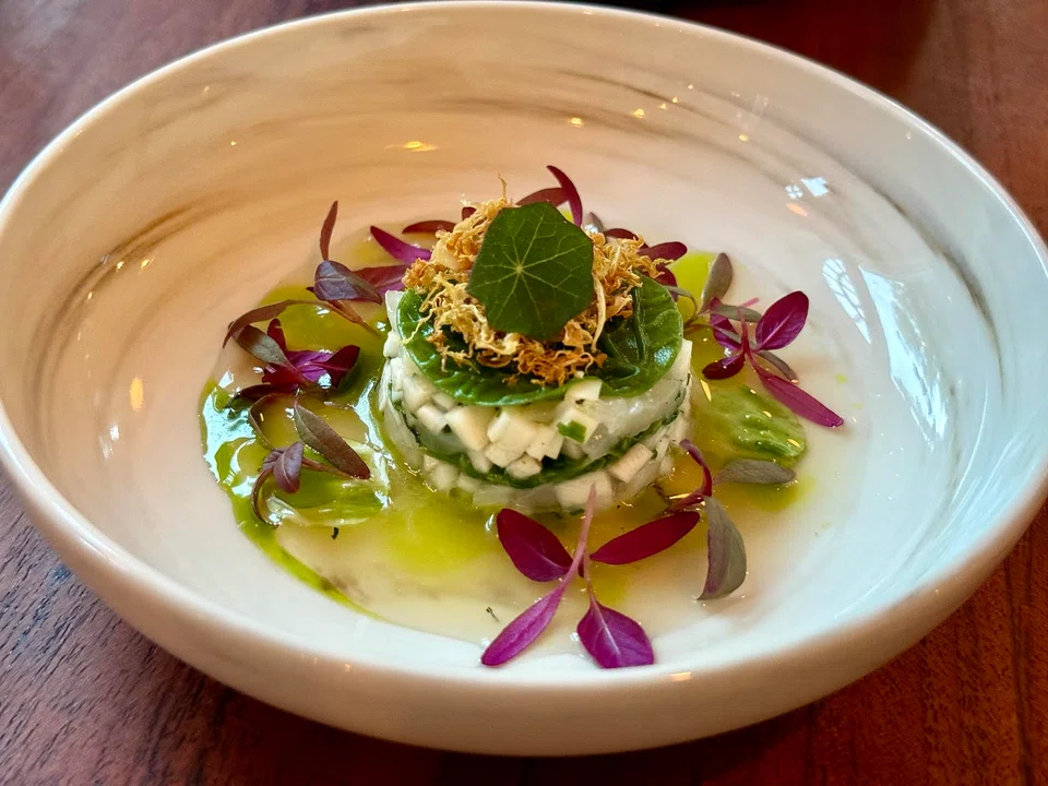Crunchy celeriac is paired with scallops and savoy cabbage.