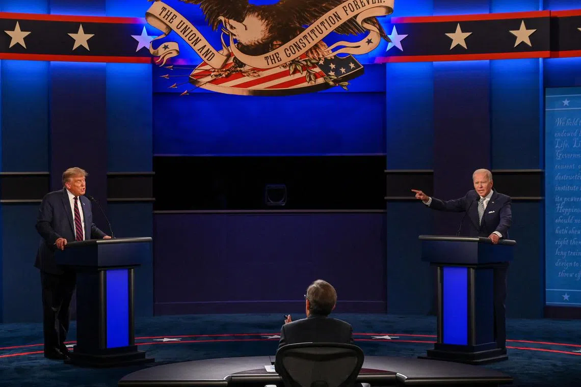 (FILES) US President Donald Trump (L) and Democratic Presidential candidate and former US Vice President Joe Biden exchange arguments during the first presidential debate at Case Western Reserve University and Cleveland Clinic in Cleveland, Ohio, on September 29, 2020. Just like in 2016, the first debate of the 2020 presidential election turned into chaos. Now the incumbent president, Donald Trump constantly interrupts Joe Biden, who ends up throwing back a memorable "will you shut up, man"? The Democrat also calls his opponent a "clown" or "Putin's poodle". Predictably, Donald Trump refuses to say whether he will recognize the result of the election. Unable to keep the two candidates at bay, the debate moderator, Fox News journalist Chris Wallace, confessed to feeling "despair". (Photo by Jim WATSON / AFP)