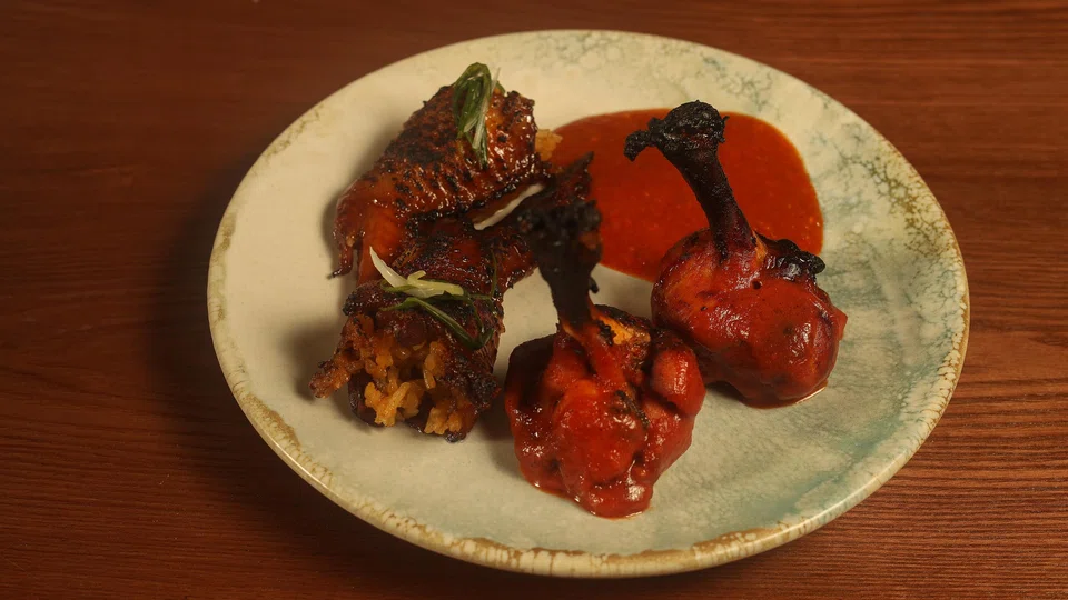 Bak bak wings comprise rice-stuffed and char siew-marinated chicken wings.