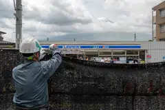 Workers began putting the black netting measuring 2.5 by 20 metres in place on Tuesday.