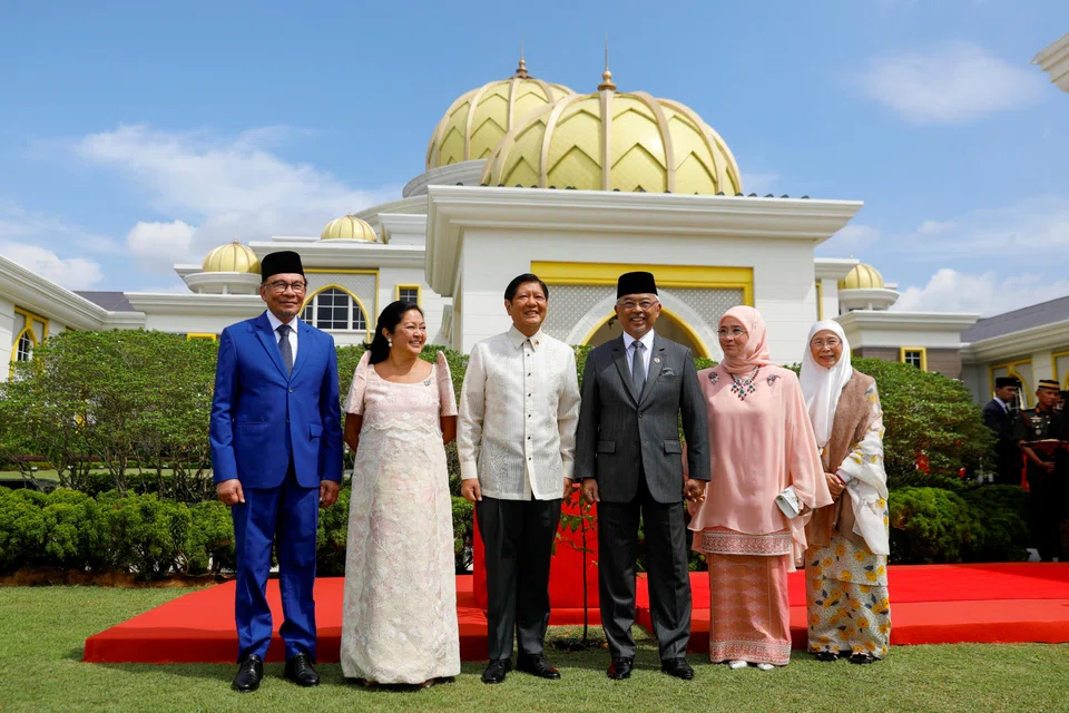 Malaysia's King Sultan Abdullah Sultan Ahmad Shah with Queen Azizah Aminah Maimunah, Philippine President Ferdinand Marcos Jr with First Lady Maria Louise Araneta Marcos, and Malaysian Prime Minister Anwar Ibrahim with his wife Wan Azizah Wan Ismail at the National Palace in Kuala Lumpur on Jul 26, 2023. 