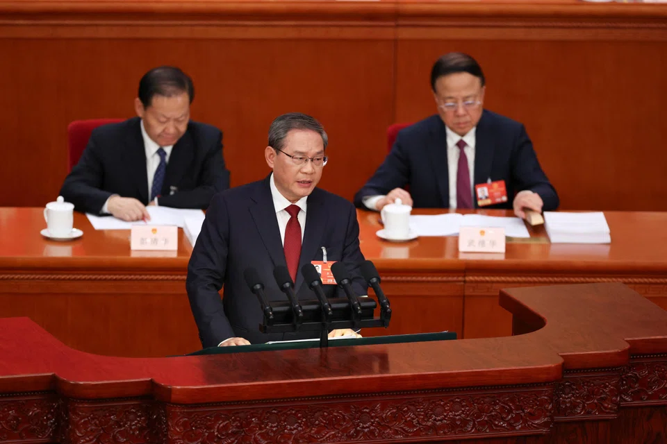 Chinese Premier Li Qiang delivers a work report during the opening session of the National People's Congress at the Great Hall of the People in Beijing, China, March 5, 2026. 