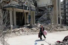 Damaged buildings in Teheran following a strike on a police station on Mar 4.