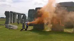 Footage of the stunt showed several people trying to restrain the pair as they sprayed the standing stones, before the duo stopped and remained sat on the ground.