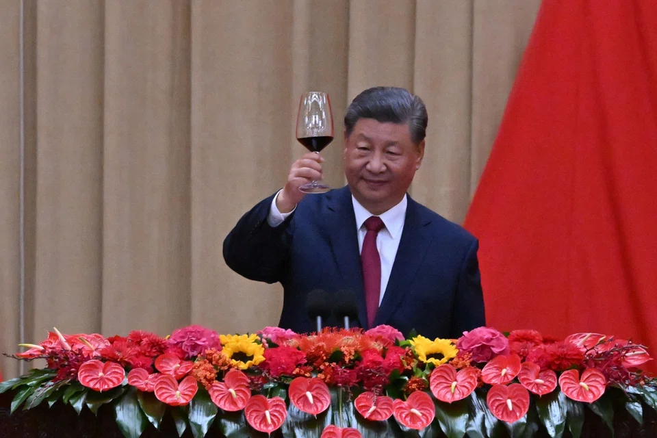 China's President Xi Jinping makes a toast during a reception on the eve of National Day at the Great Hall of the People in Beijing on Sep 30, 2024. He says China must be mindful of potential dangers and be prepared for rainy days.