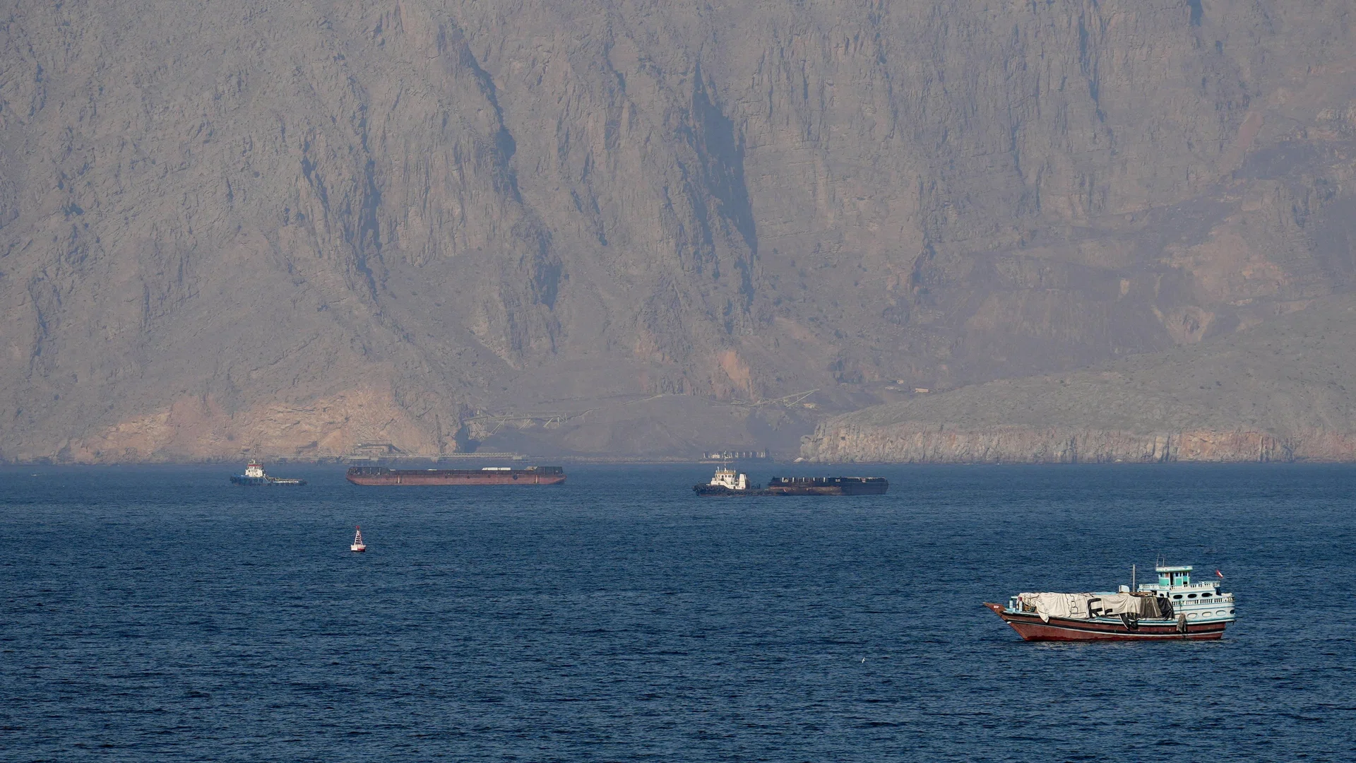 Iran warns US Navy to stay clear of Hormuz after Trump says US to help stranded ships