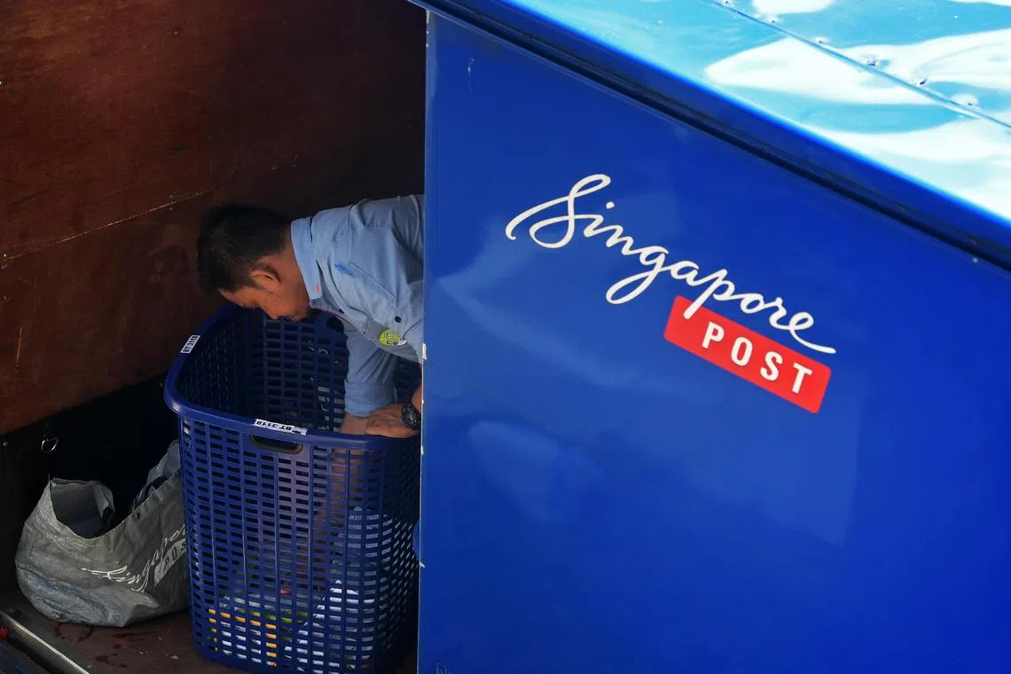 Singpost postman packing his mail in the Singpost delivery truck in Toa Payoh on 27 Mar 2020.