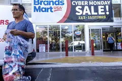 Customers walk outside Brands Mart store during the Cyber Monday event in Miami, Florida, US, Nov 27, 2023. 