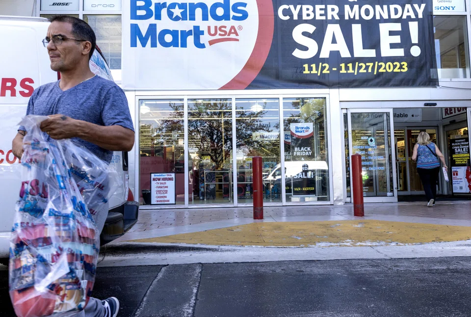 Customers walk outside Brands Mart store during the Cyber Monday event in Miami, Florida, US, Nov 27, 2023. 