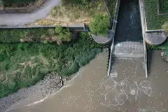 An aerial view of the outfall into the River Thames, at Thames Water's Crossness Sewage Treatment Works, in London, Britain, July 3, 2023. The Labour government said it had now introduced proposed legislation into parliament promising to give tougher powers to regulators and come down hard against companies damaging the environment.