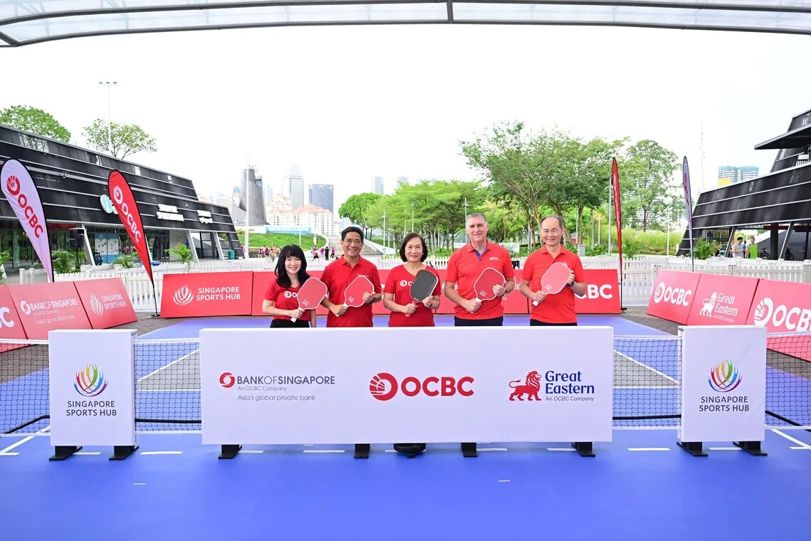 From left: OCBC head of group brand and communications Koh Ching Ching; Bank of Singapore CEO Jason Moo; OCBC CEO Helen Wong; Great Eastern CEO Greg Hingston; and KASM CEO Quek Swee Kuan at the Sports Hub on Oct 25.