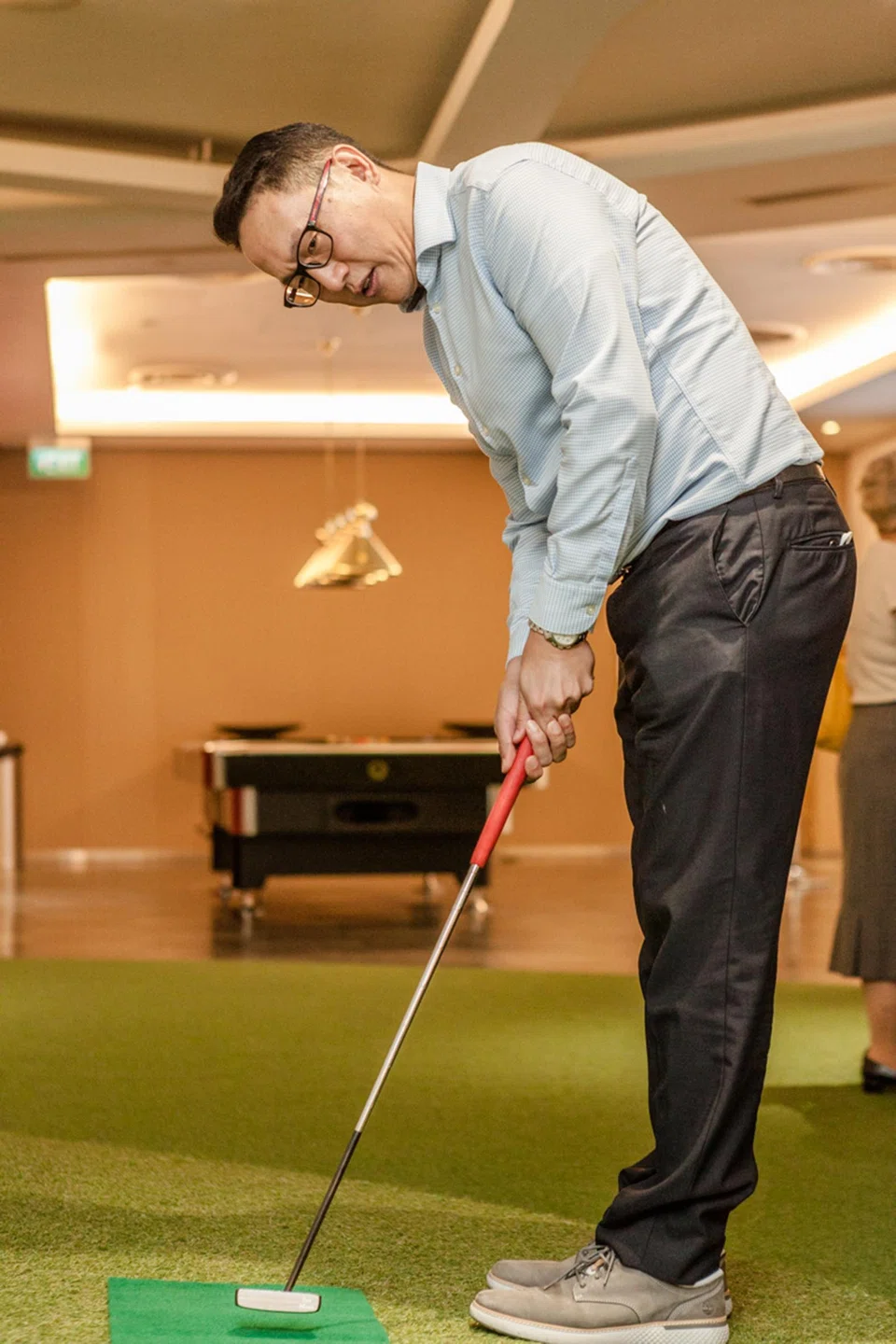 Eugene Teo, CEO of Shorea Capital, tries his hand at some putting. 