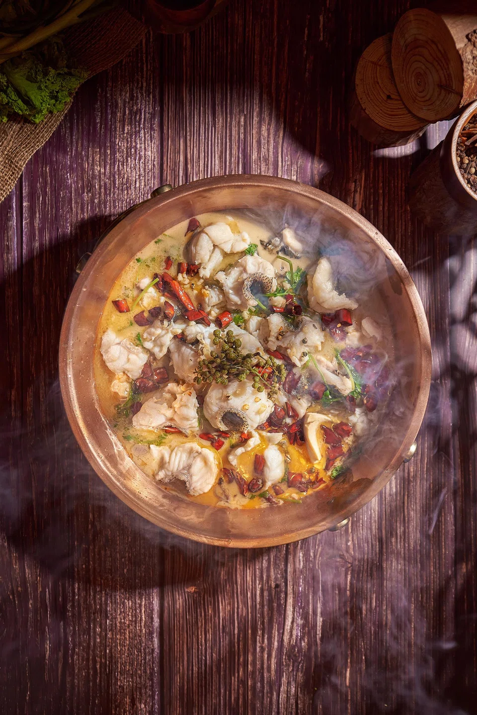 Poached fish in sichuan chilli oil is more comfortingly mild than numbingly spicy.