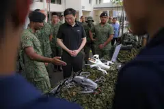 Prime Minister Lawrence Wong on a tour of the static drone display during his visit to Mandai Hill Camp on Thursday (Apr 9).