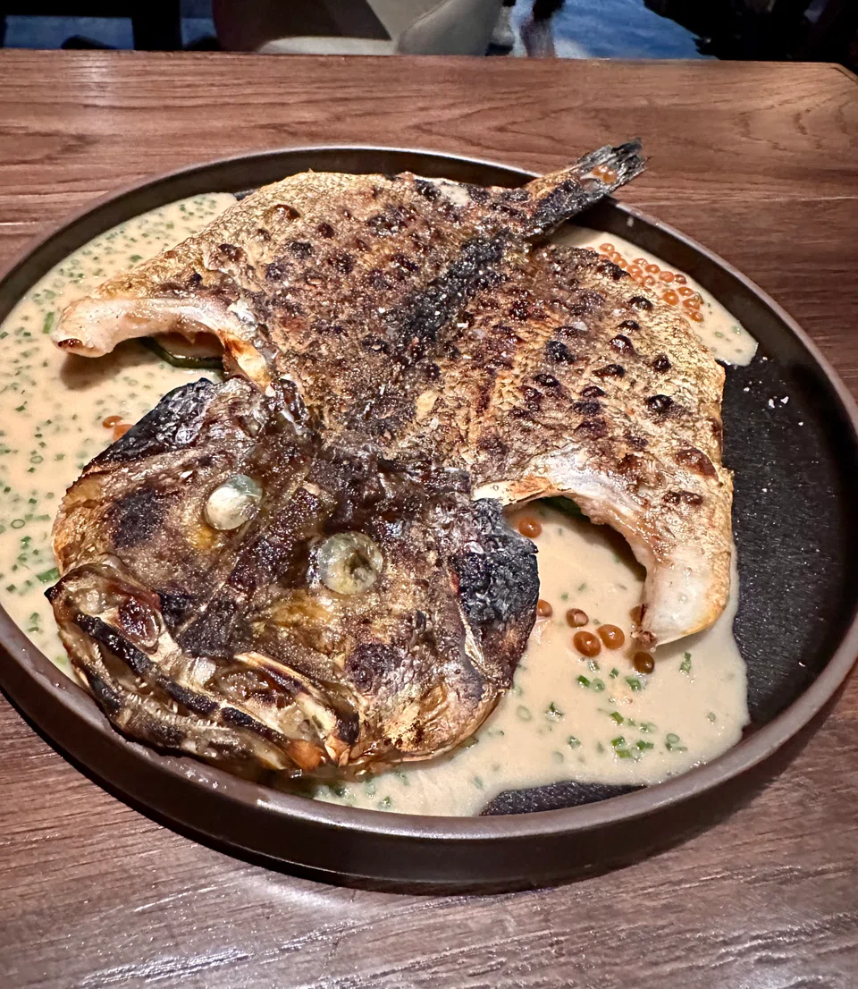Red snapper char-grilled and served in yuzu beurre blanc sauce