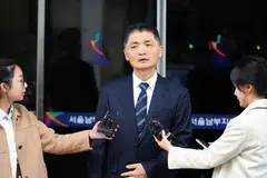 Kakao Corp founder Kim Beom Su speaks to the media as he leaves the Southern District Court in Seoul, South Korea, Oct 21, 2025. 