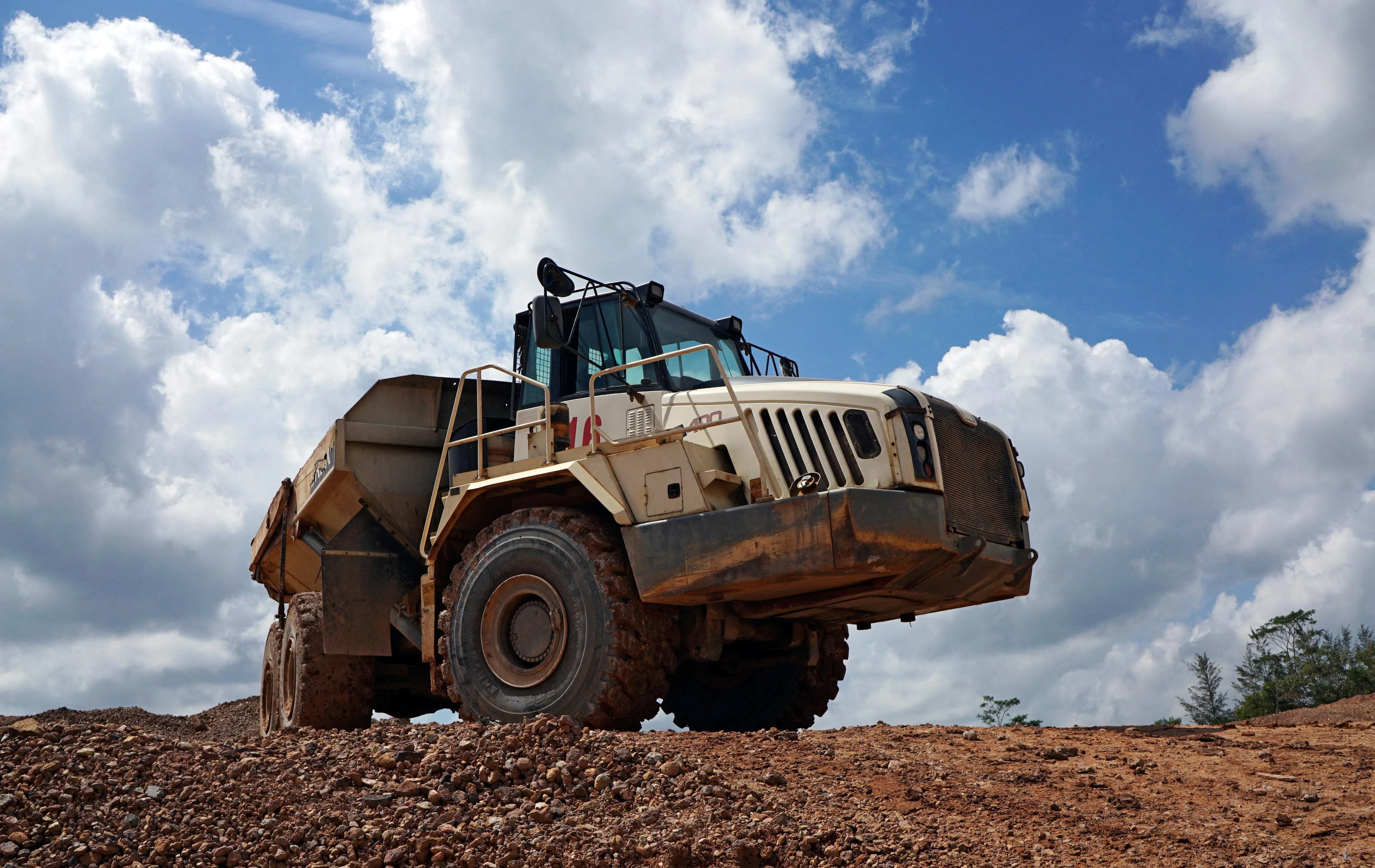 A truck passes through a tin mining area of Indonesia's PT Timah in Pemali, Bangka island, Indonesia, July 25, 2019. A number of tin executives were convicted for colluding to conduct illegal mining.