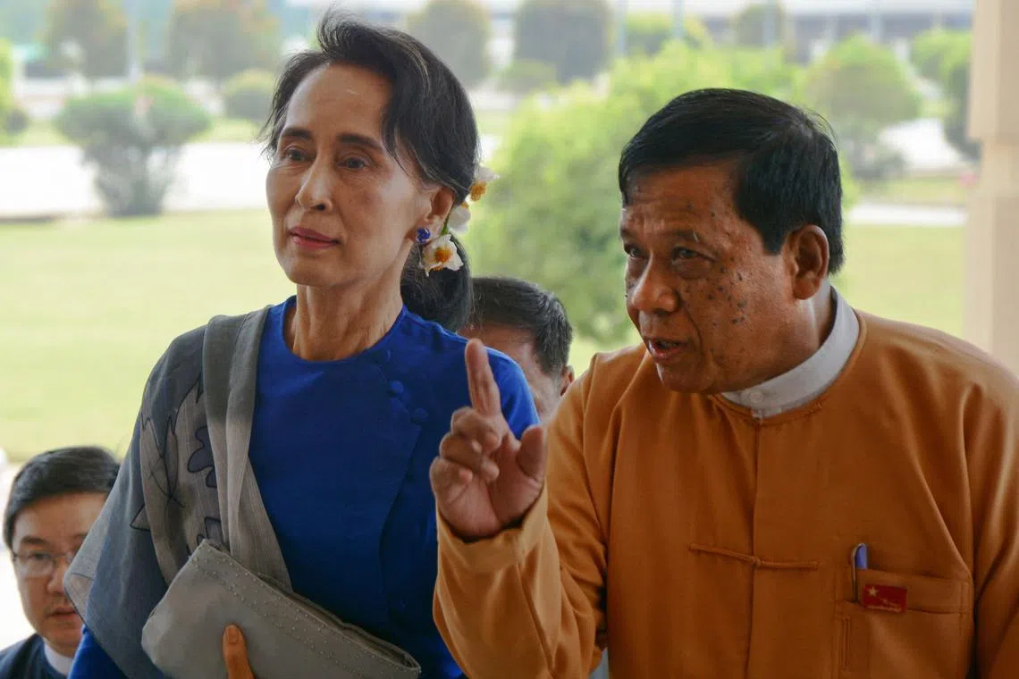 Myanmar's National League for Democracy senior leader and lawmaker Zaw Myint Maung (right) escorts Myanmar democracy leader Aung San Suu Kyi during her arrival at the parliament in Naypyidaw on March 1, 2016. Zaw died of leukaemia on Oct 7, 2024 aged 72.