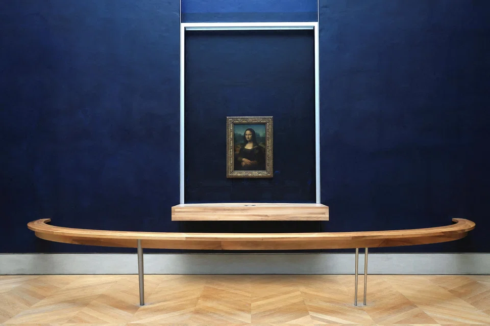 The Mona Lisa by Leonardo da Vinci at the Louvre museum in Paris, France.