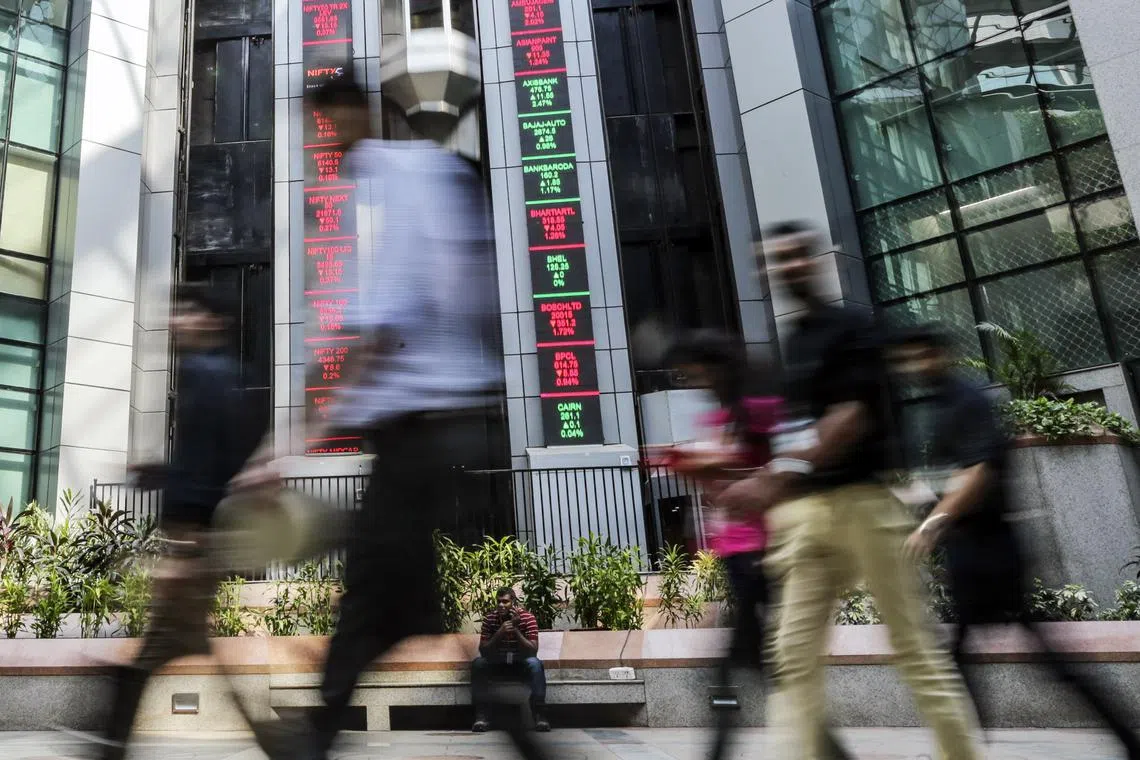People walk past the National Stock Exchange in Mumbai. India’s real-time payments system, Unified Payments Interface, has made great strides since it was launched  six years ago in 2016